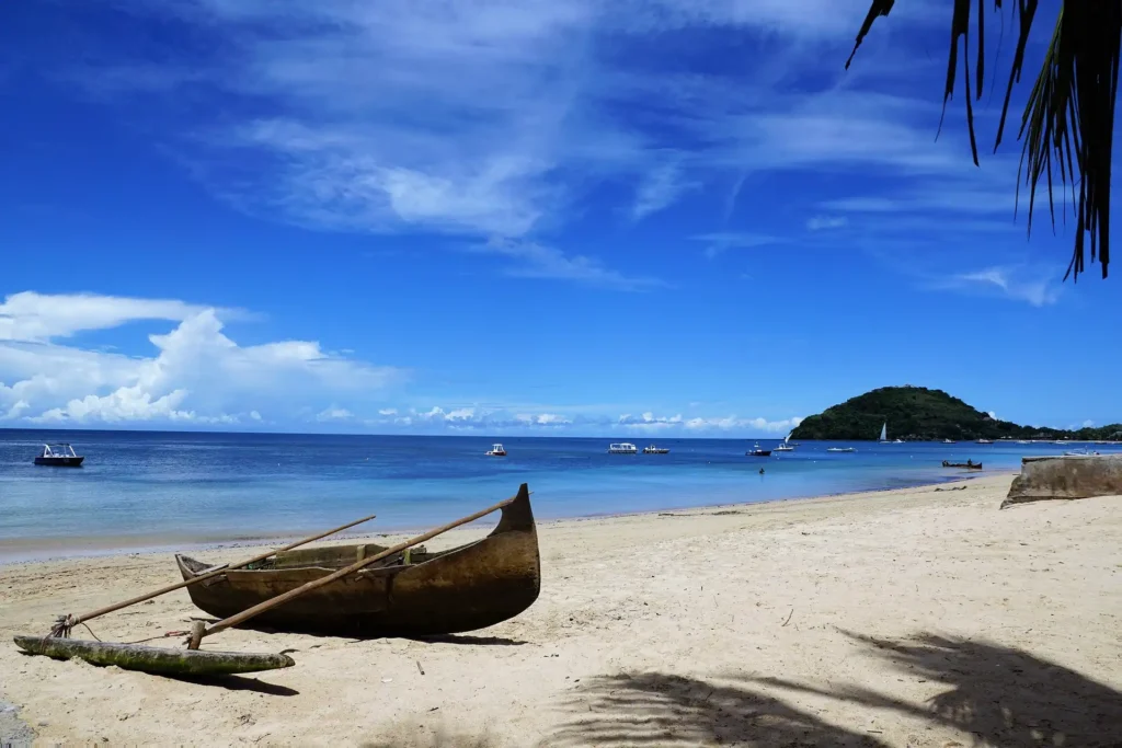 Madagascar best beaches, Canoe ready for trip, tropical paradise beach of madagascar, madagascar's pristine beaches, madagascar canoe aventure awaits, Paddle through Madagascar's breathtaking coastline, Madagascar beach escape, Madagascar's untouched beaches, Madagascar canoeing excursion, Madagascar beach paradise
